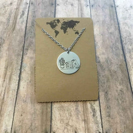 Stack of books with plant circular pendant